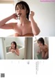 A woman in a bathtub brushing her teeth. 